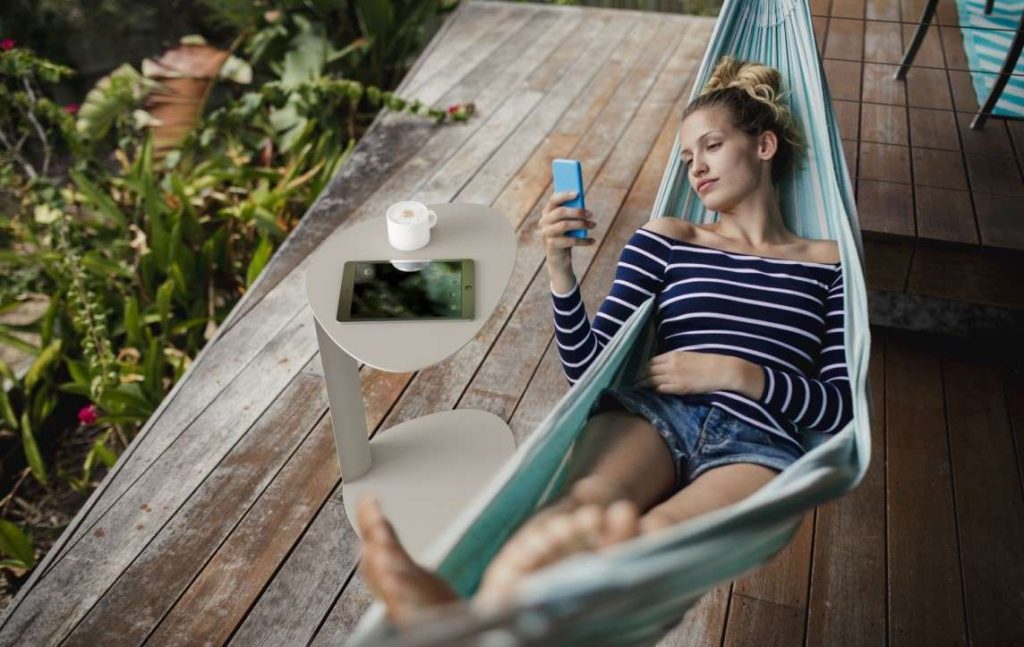 Woman in hammock next to Bink table
