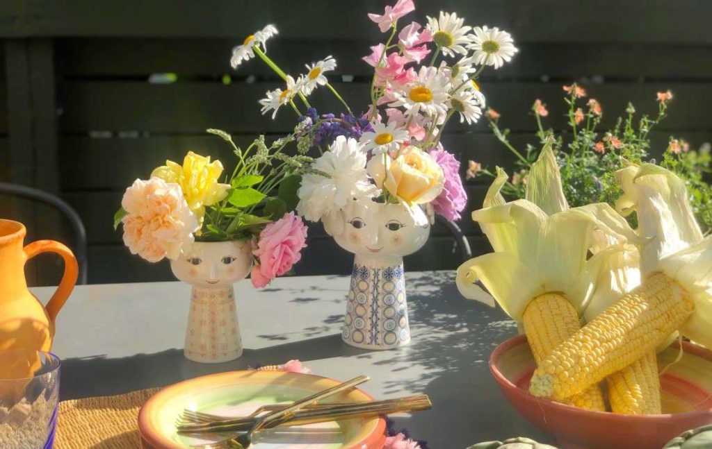 Tablescape with Eva vases and colorful tableware